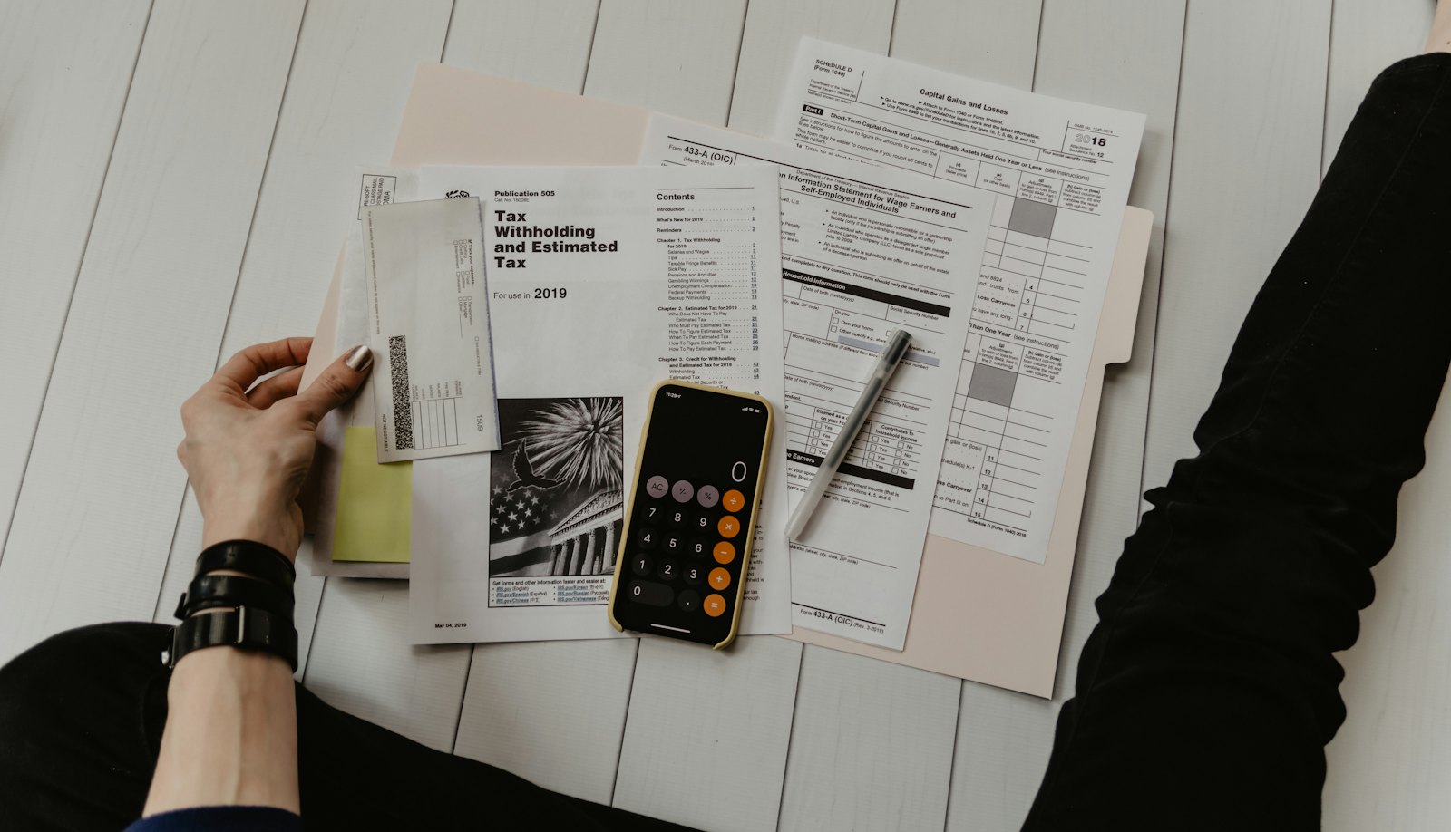 Loan documents and a calculator, representing AI loan origination with LOA